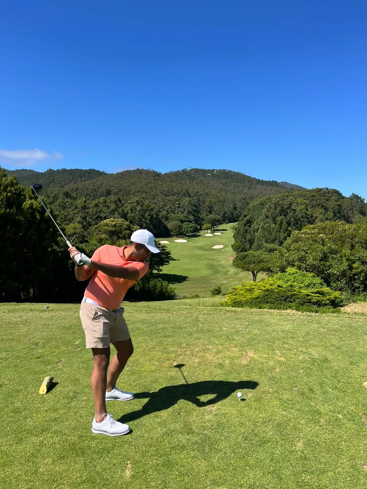 Tee shot in front of the mountains